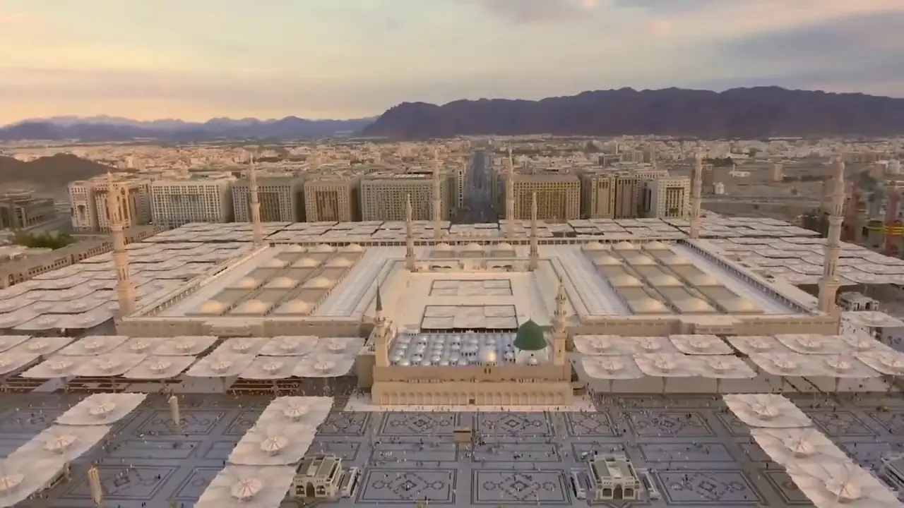Aerial view over the courtyards and white shade umbrellas of Al-Masjid an-Nabawi, the Prophet’s Mosque, in Madinah